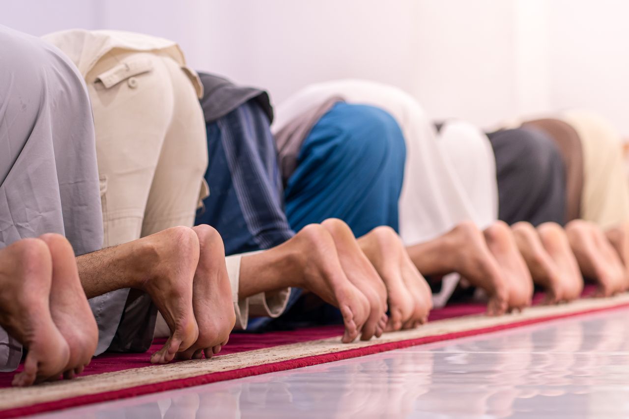 A group of Muslims in deep prayer at a mosque in Sulawesi Selatan, Indonesia.
