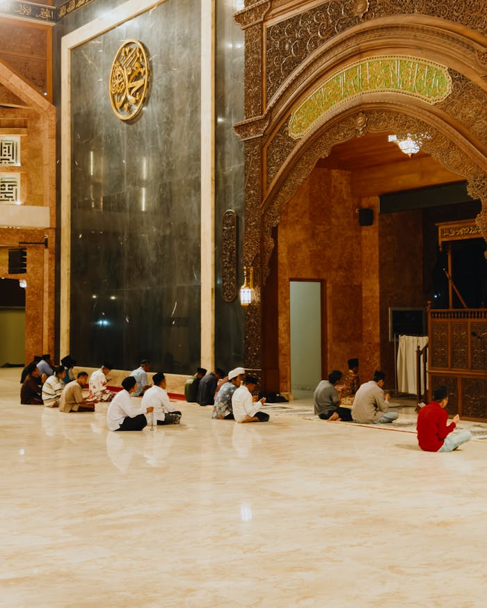 Worshippers engaged in prayer inside the ornate Grand Mosque in Cirebon, Indonesia.